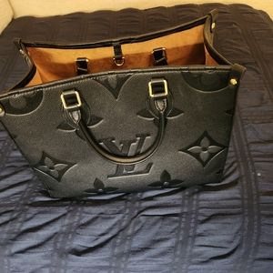 New black Louis Vuitton on the go Bag 2400 retail is 3440